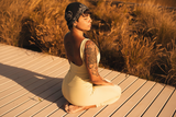 Jumpsuit in light yellow - meditation pose
